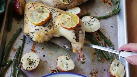 Chicken dinner from a sheet pan Stock Footage 91448693