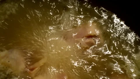 Chicken drumsticks is being boiled Stock Footage 273530368