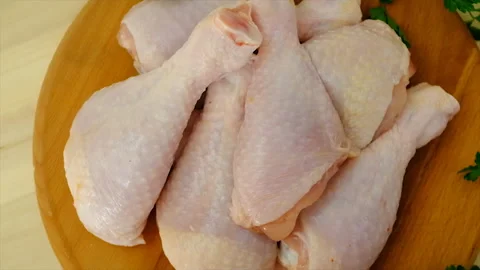 Chicken drumsticks raw on the board. selective focus. Stock Footage 197270909