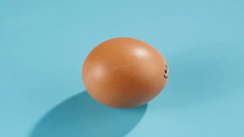 Chicken egg on blue background top view. Preparing for Easter, painting and Stock Footage 171029995