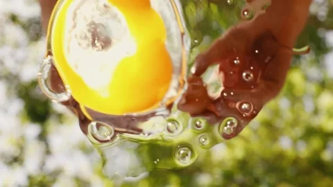 Chicken egg is broken on camera close up view from below Stock Footage 130788053