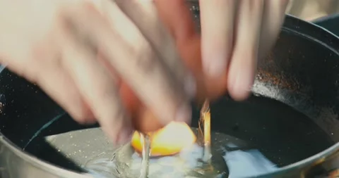 Chicken egg frying in a pan close up Stock Footage 130990888