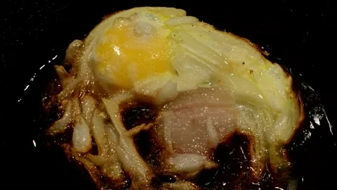 Chicken egg with onion and ham Stock Footage 273194858