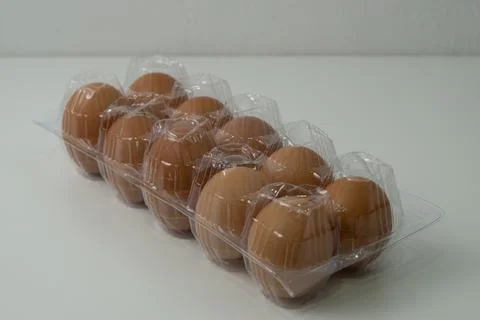 Chicken egg with plastic container on white background 42 Stock Photos