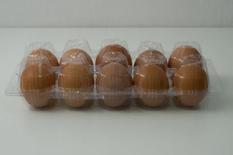 Chicken egg with plastic container on white background 30 Stock Photos