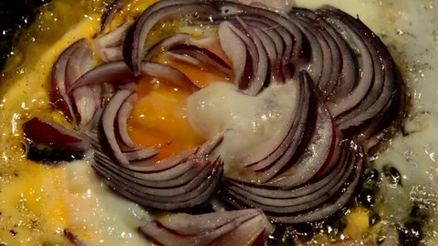 Chicken egg with red onion are fried Stock Footage 273190892