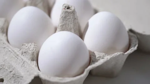 Chicken egg rotates on a white background. Stock Footage 234405852