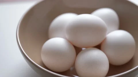 Chicken egg rotates on a white background. Stock Footage 234405928