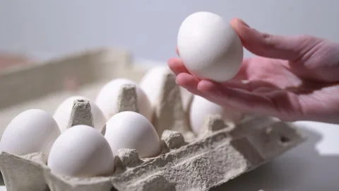 Chicken egg rotates on a white background. Stock Footage 234406012