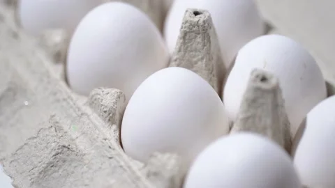 Chicken egg rotates on a white background. Stock Footage 234406100