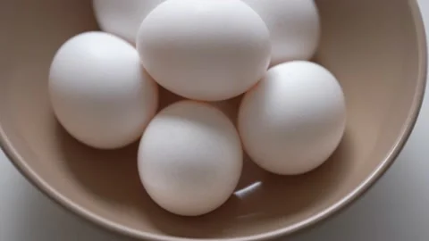 Chicken egg rotates on a white background. Stock Footage 234406192