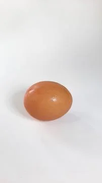 A chicken egg on a white background, one egg can meet the daily requirement o Stock Photos