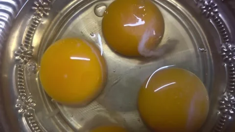 Chicken egg yolks filled with raw albumen Stock Footage 274468375
