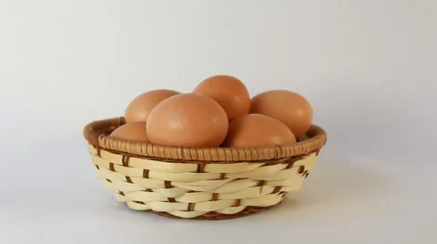 Chicken eggs are in a basket Stock Footage 55784811