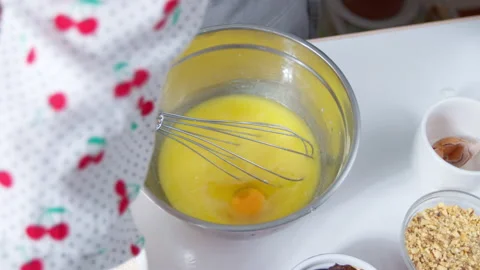Chicken eggs are broken to make the dough. Stock Footage 152738973