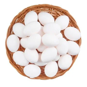 Chicken eggs in basket isolate on white background, top view Stock Photos