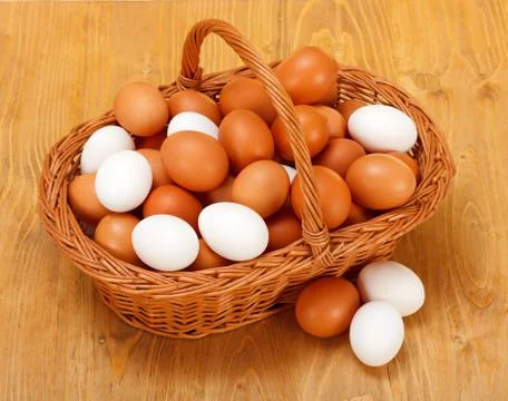 Chicken eggs in basket Stock Photos