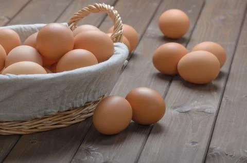 Chicken eggs in a basket Stock Photos