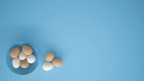 Chicken eggs into a blue cup on the table, blue background with copy space, b Stock Illustration