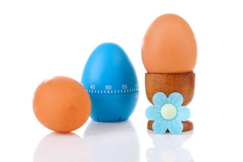 Chicken eggs with blue timer Foto stock