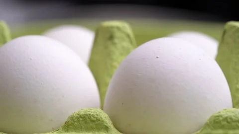 Chicken eggs in cardboard container, moving the camera to the side Stock Footage 231579790