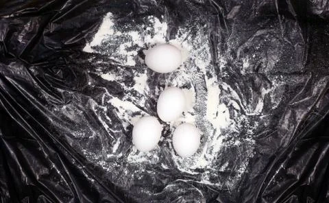 Chicken eggs in dark background Stock Photos