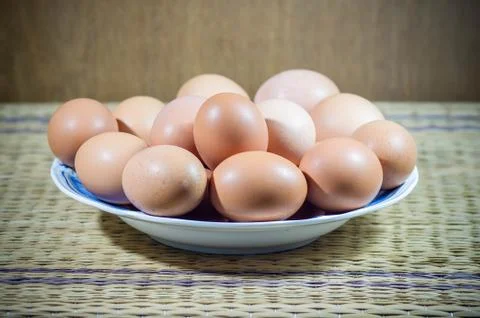 Chicken eggs in a dish. Stock Photos