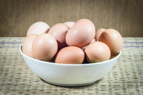 Chicken eggs in a dish. Stock Photos