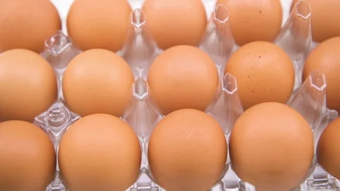 Chicken eggs dozen panning macro closeup shot, organic fresh raw food Stock Footage 227163476
