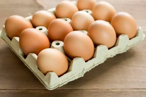 Chicken eggs in an egg cup Stock Photos