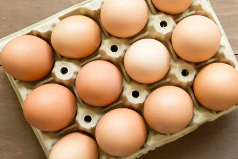 Chicken eggs in an egg cup Stock Photos