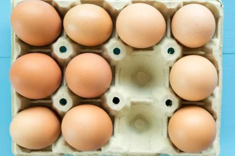 Chicken eggs in an egg cup Stock Photos