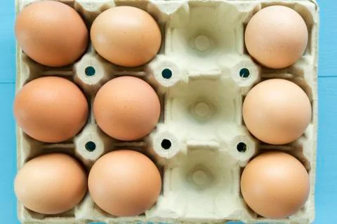 Chicken eggs in an egg cup Stock Photos