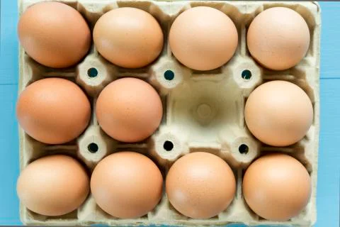 Chicken eggs in an egg cup Stock Photos