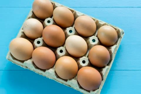 Chicken eggs in an egg cup Stock Photos