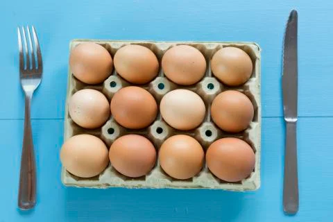 Chicken eggs in an egg cup Stock Photos