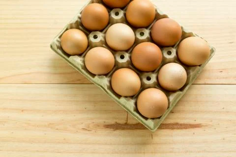 Chicken eggs in an egg cup Stock Photos
