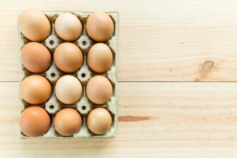 Chicken eggs in an egg cup Stock Photos