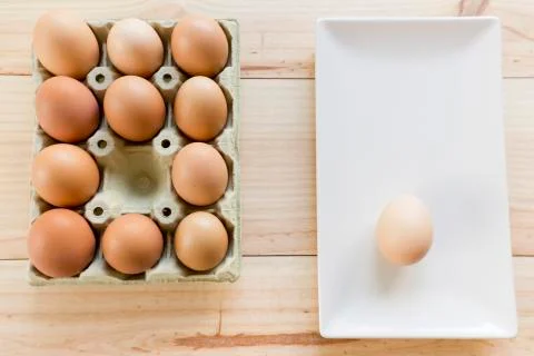Chicken eggs in an egg cup Stock Photos