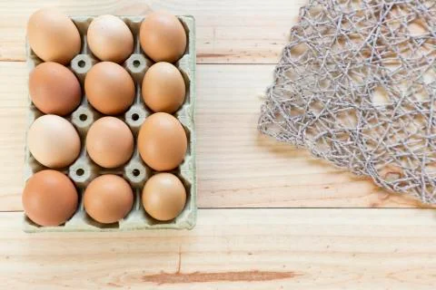 Chicken eggs in an egg cup Stock Photos