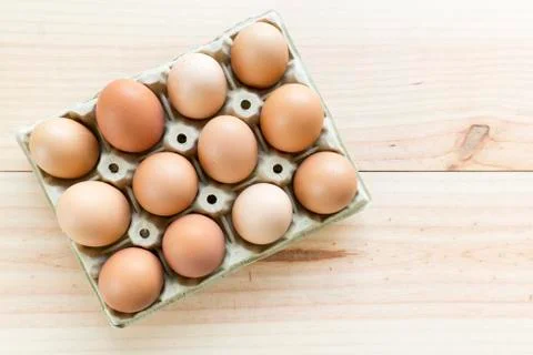 Chicken eggs in an egg cup Stock Photos