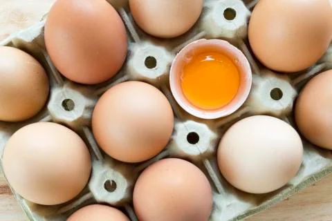 Chicken eggs in an egg cup Stock Photos