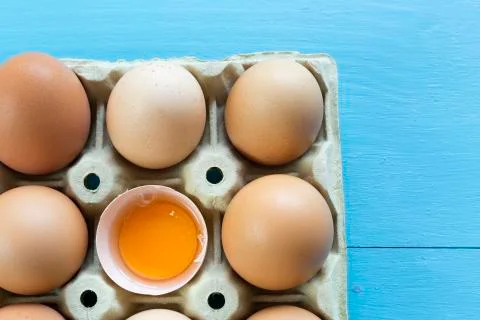 Chicken eggs in an egg cup Stock Photos