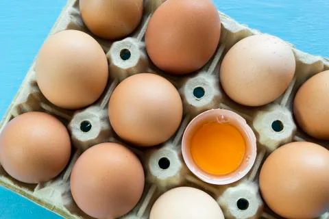 Chicken eggs in an egg cup Stock Photos