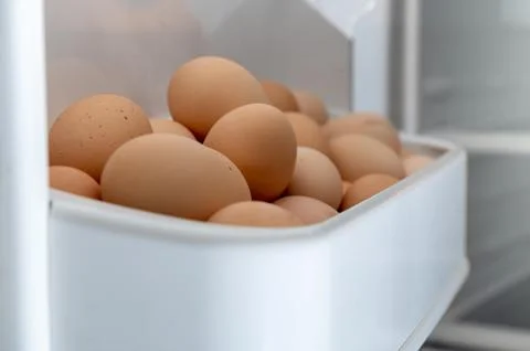 Chicken eggs in the fridge. Preparation for Easter. Stock Photos