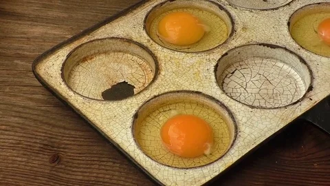 Chicken eggs in a frying pan. Rustic style. Stock Footage 71615453