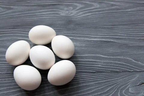 Chicken eggs on a gray background Stock Photos