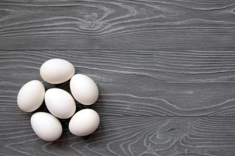 Chicken eggs on a gray background Stock Photos