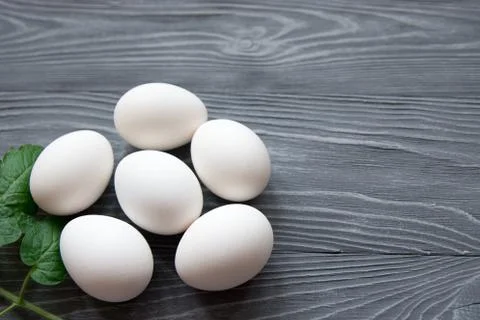 Chicken eggs on a gray background Stock Photos