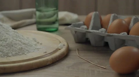 Chicken eggs in the package on a wooden table. Stock Footage 67441035